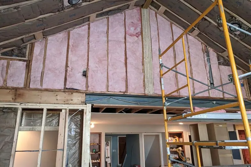 Insulated vaulted ceiling in a room addition with scaffolding